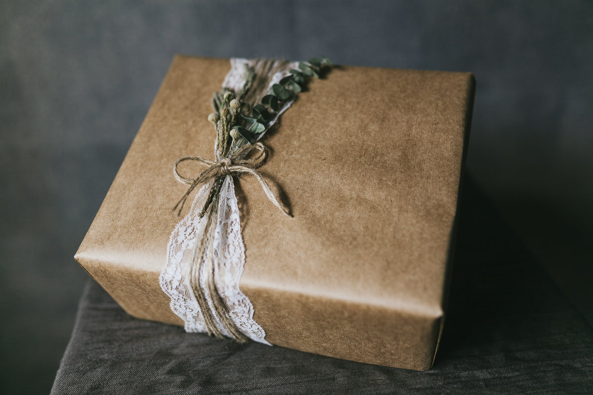 A beautifully composed gift ready to be given, evoking the quiet ritual of gifting