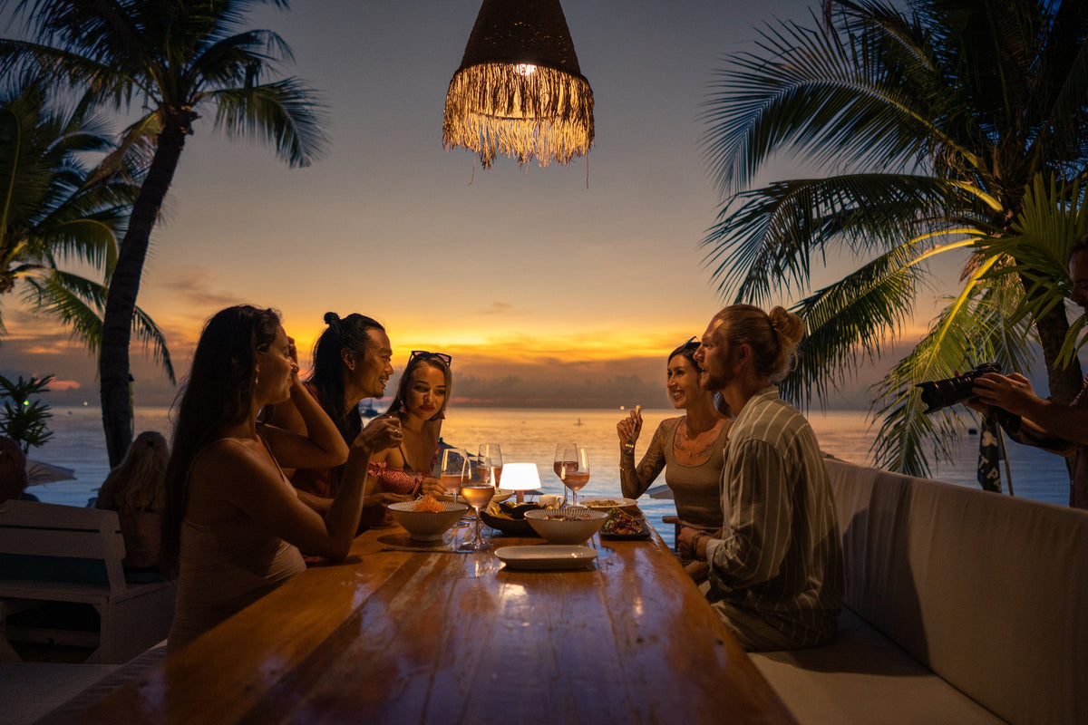 A softly lit dinner table in the quiet hours after a shared meal